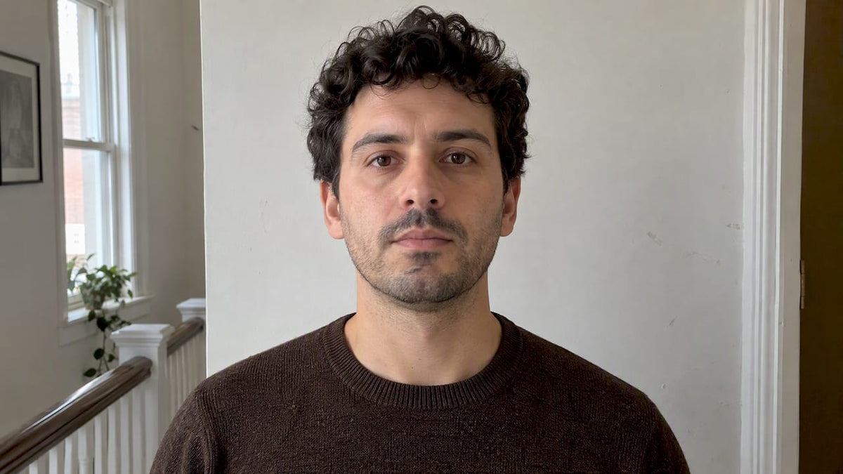 Man posing for a green card photo